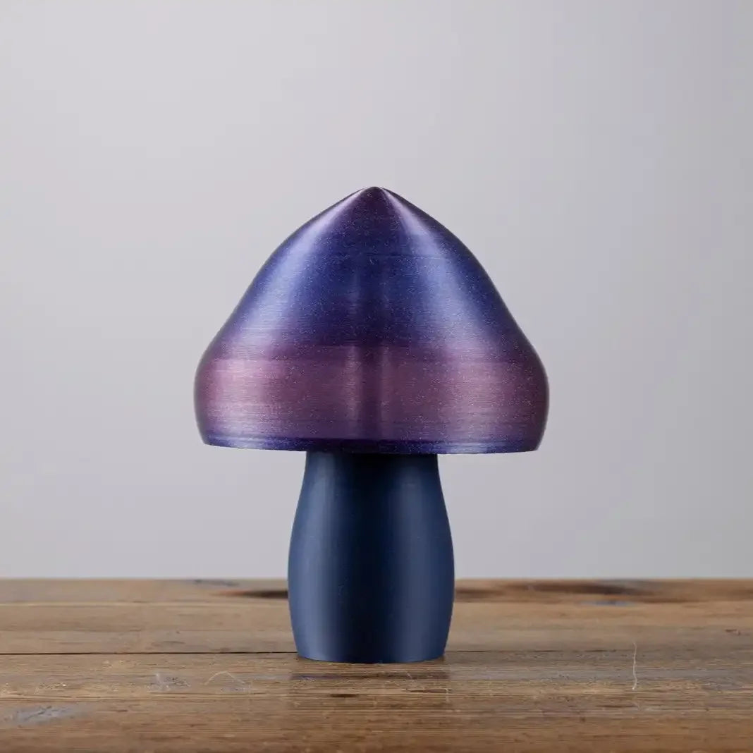 Lorsqu'elle est éteinte, la lampe champignon laisse apparaitre un léger pailletage qui lui donne une touche très tendance. Idéal pour la table de nuit ou dans un salon